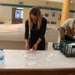 Woman sorting items for display