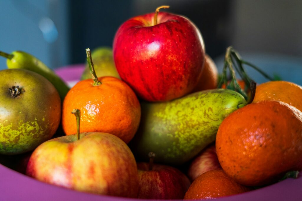 Fruit bowl featuring apples, oranges and pears
