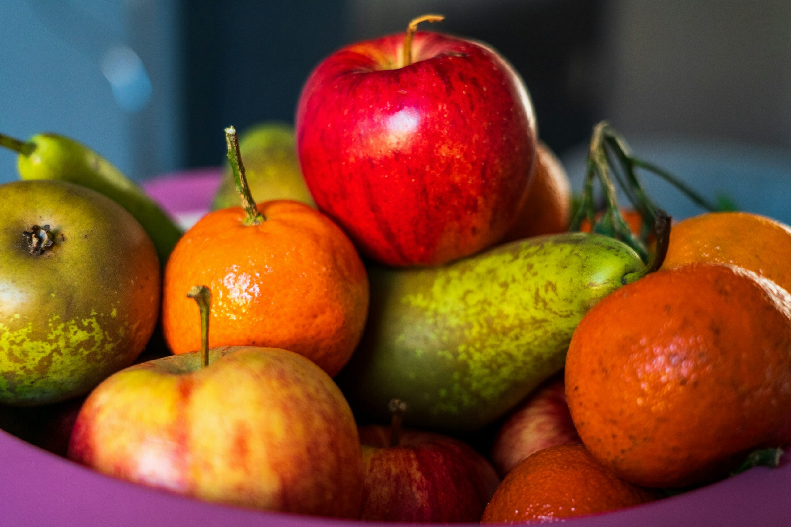 Fruit bowl featuring apples, oranges and pears