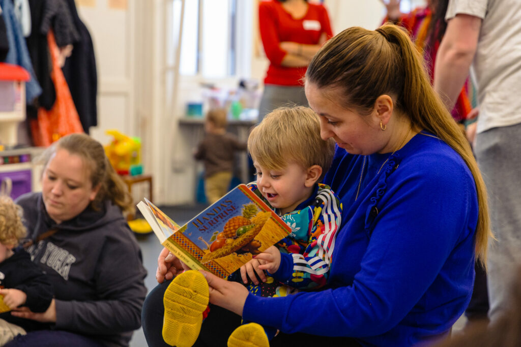 Mother and baby reading a book