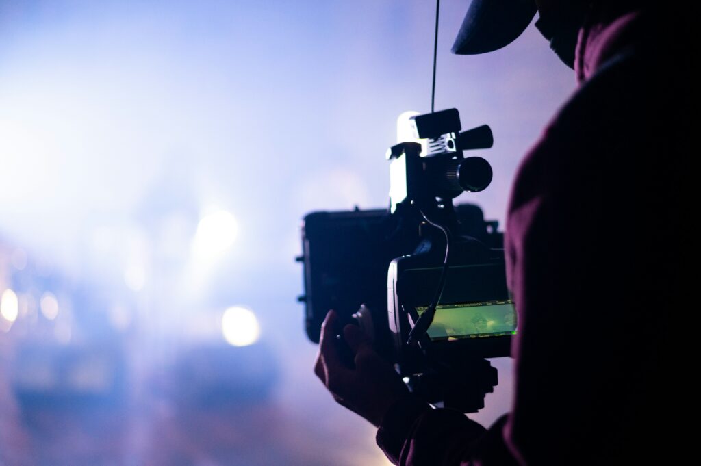 person-manning-video-camera